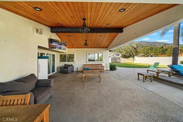 9179 Hidden Farm Rd, Rancho Cucamonga, CA 91737 - view of patio / terrace featuring a mountain view, fence, and an outdoor hangout area