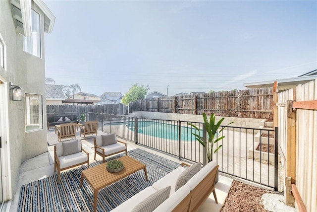 exterior space with a fenced backyard, a fenced in pool, and an outdoor living space
