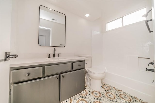 bathroom with visible vents, tile patterned flooring, vanity, toilet, and tub / shower combination