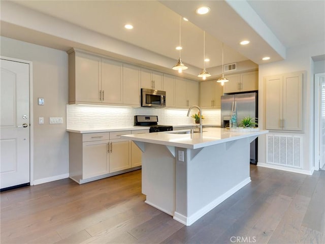418 Maravilla Ln, Brea, CA 92823 - kitchen with appliances with stainless steel finishes, a sink, light countertops, dark wood-style floors, and recessed lighting