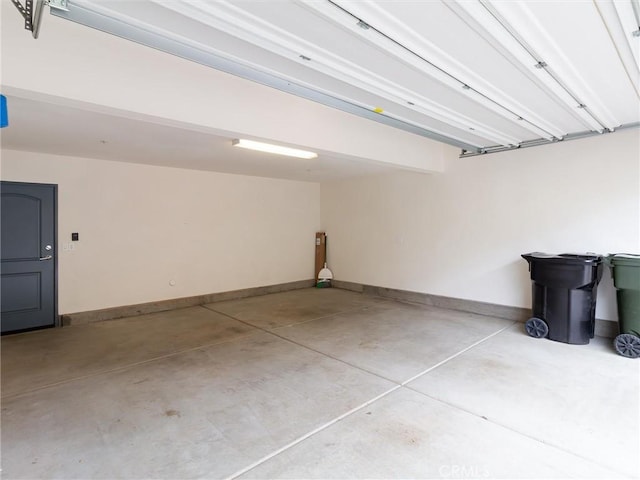 garage featuring baseboards