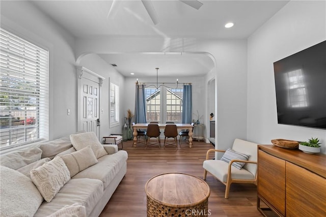 living room featuring recessed lighting, arched walkways, a ceiling fan, and wood finished floors