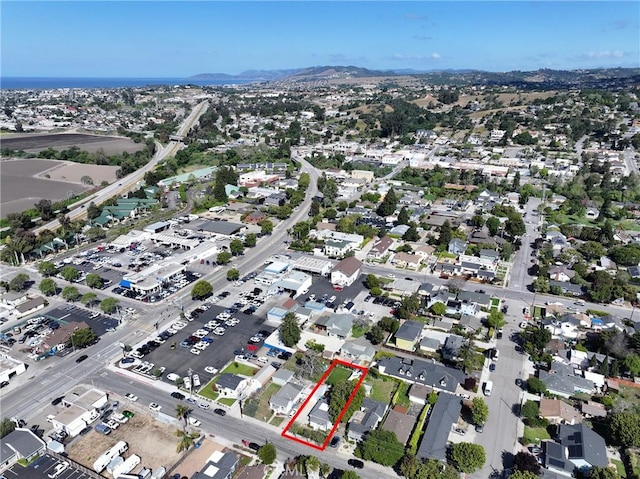 birds eye view of property featuring a mountain view