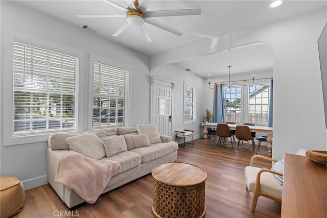 living room featuring visible vents, wood finished floors, baseboards, recessed lighting, and a ceiling fan