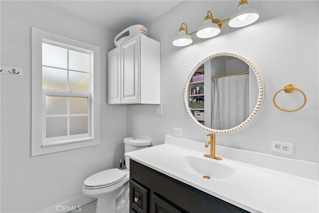 full bathroom featuring toilet and vanity