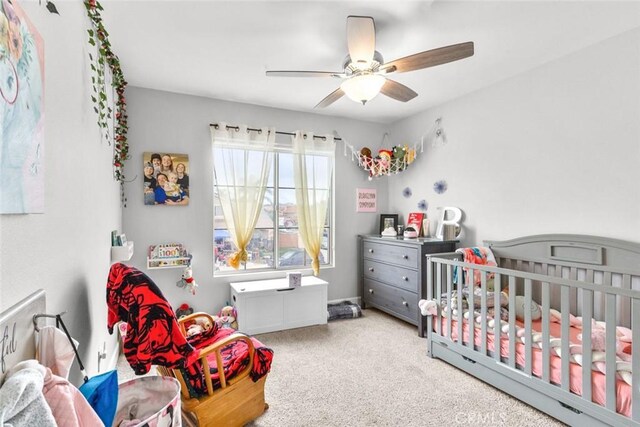 carpeted bedroom featuring a ceiling fan
