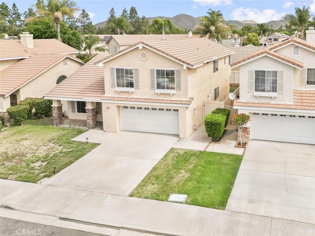28582 Sand Island Way, Menifee, CA 92584 - traditional-style home featuring a garage, a mountain view, stucco siding, and driveway