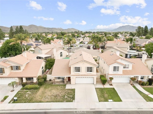 drone / aerial view with a residential view and a mountain view
