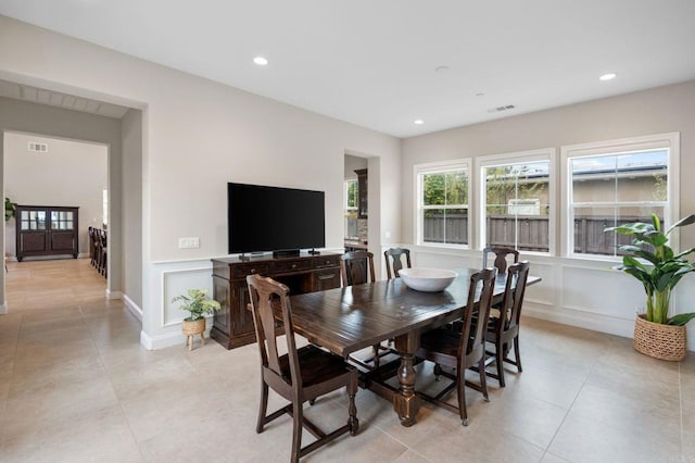 956 Urania Ave, Encinitas, CA 92024 - dining room featuring a decorative wall, light tile patterned floors, wainscoting, and recessed lighting