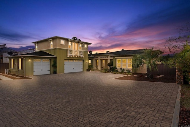 956 Urania Ave, Encinitas, CA 92024 - view of front of property featuring decorative driveway, fence, and a garage