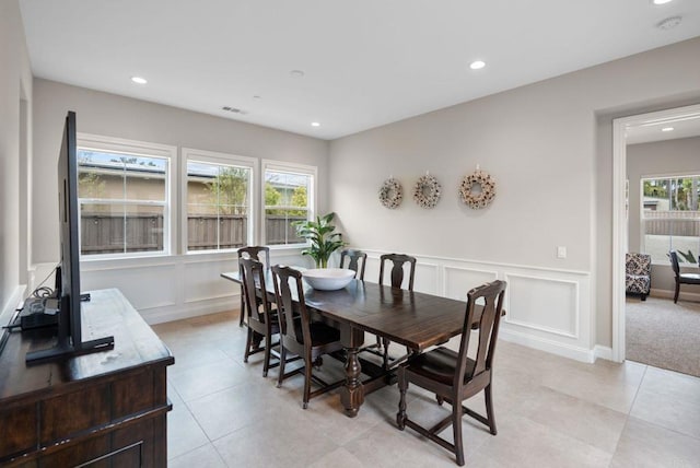 956 Urania Ave, Encinitas, CA 92024 - dining area with a decorative wall, plenty of natural light, recessed lighting, light tile patterned floors, and a wainscoted wall
