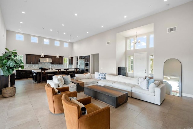 956 Urania Ave, Encinitas, CA 92024 - living area with a high ceiling, a chandelier, recessed lighting, and light tile patterned flooring