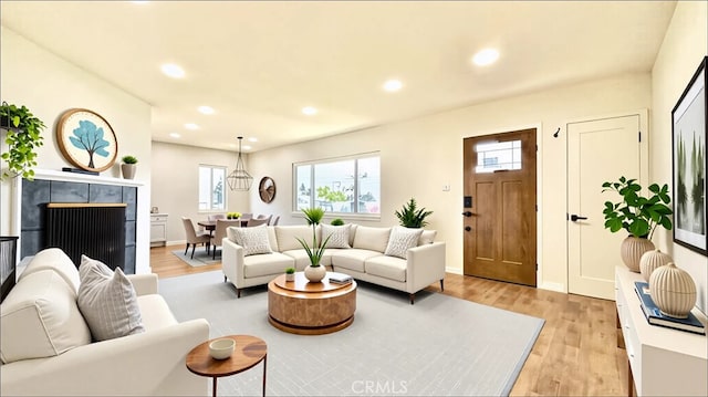 2605 W 163rd St, Torrance, CA 90504 - living room with light wood-style flooring, plenty of natural light, recessed lighting, and a tiled fireplace