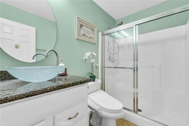 11913 Solitaire Ct, Jurupa Valley, CA 91752 - bathroom featuring vanity, toilet, and a stall shower