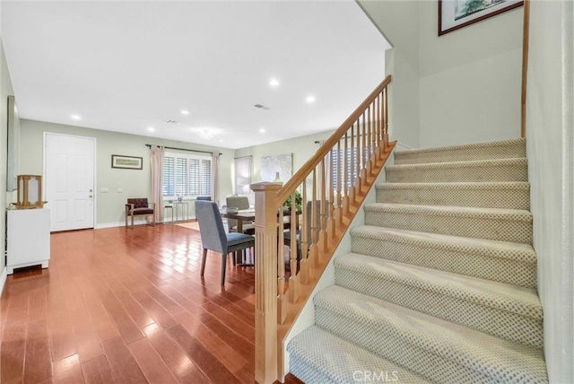 11913 Solitaire Ct, Jurupa Valley, CA 91752 - staircase with recessed lighting, baseboards, visible vents, and wood finished floors