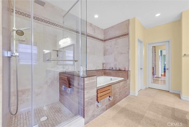 full bathroom featuring a garden tub, recessed lighting, tile patterned floors, and a shower stall