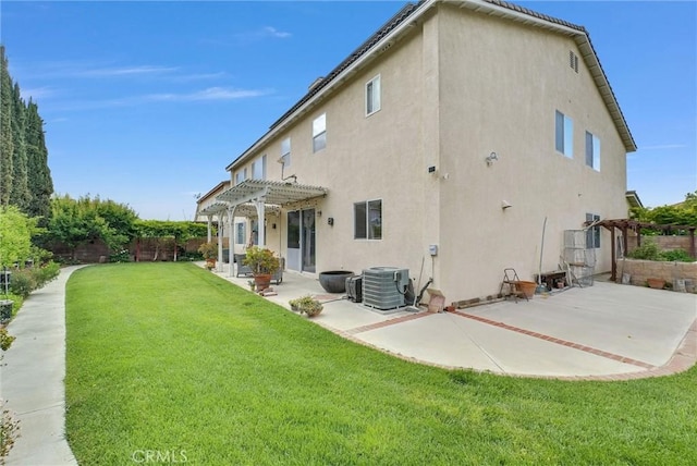 rear view of house with a patio, cooling unit, a fenced backyard, a pergola, and stucco siding