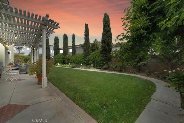 yard at dusk with a fenced backyard, a patio, and a pergola