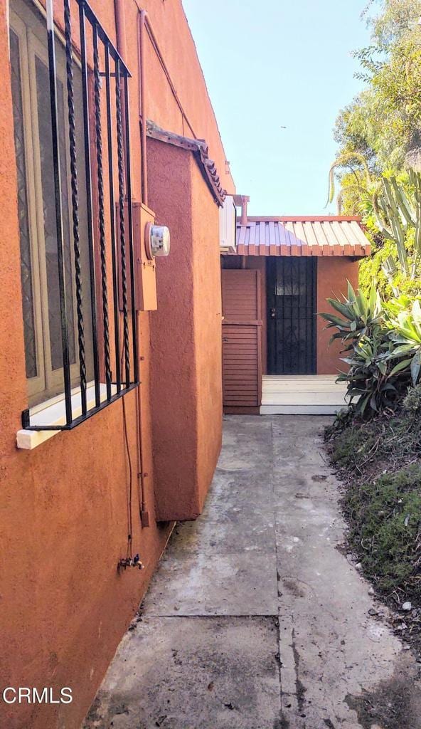 view of side of property with stucco siding