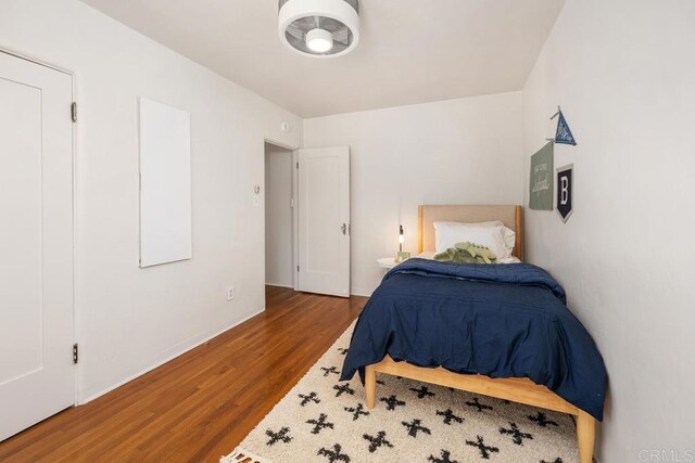 bedroom with wood finished floors
