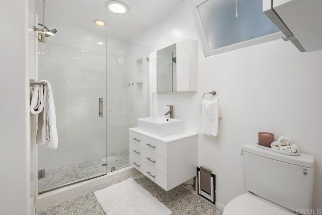 full bath featuring tile patterned flooring, a stall shower, vanity, toilet, and recessed lighting