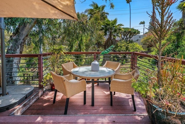wooden deck featuring outdoor dining space