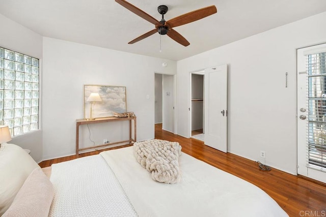 bedroom featuring a ceiling fan and wood finished floors