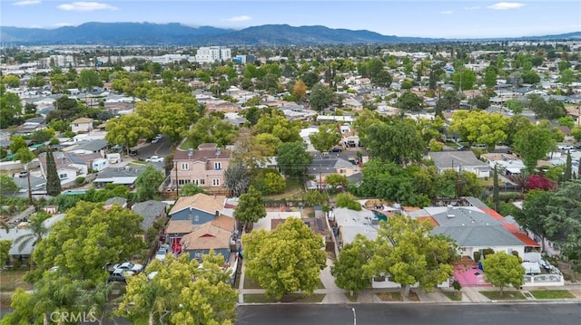 birds eye view of property with a mountain view and a residential view