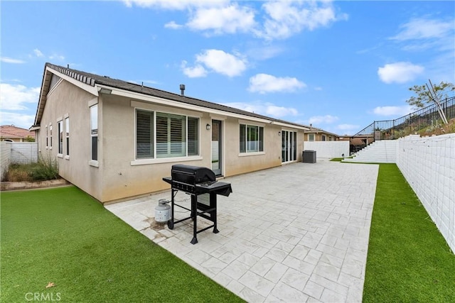 2710 Santa Fiora Dr, Corona, CA 92882 - rear view of property featuring a fenced backyard, a patio area, and stucco siding