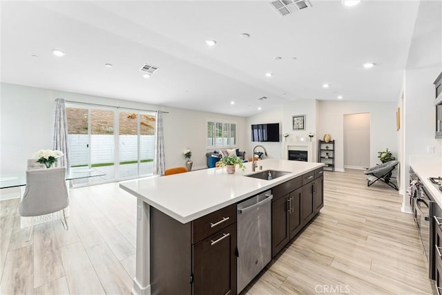 2710 Santa Fiora Dr, Corona, CA 92882 - kitchen featuring visible vents, a center island with sink, a sink, and dishwasher