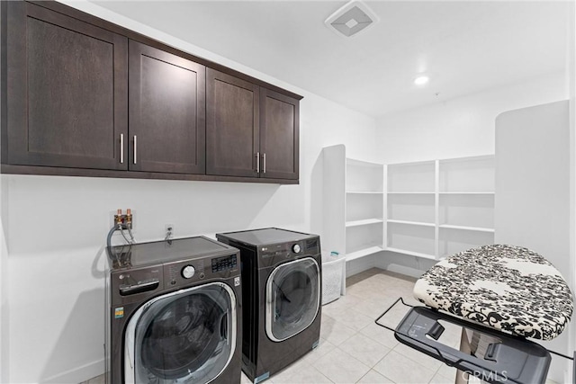 2710 Santa Fiora Dr, Corona, CA 92882 - clothes washing area featuring cabinet space, light tile patterned floors, and washer and clothes dryer