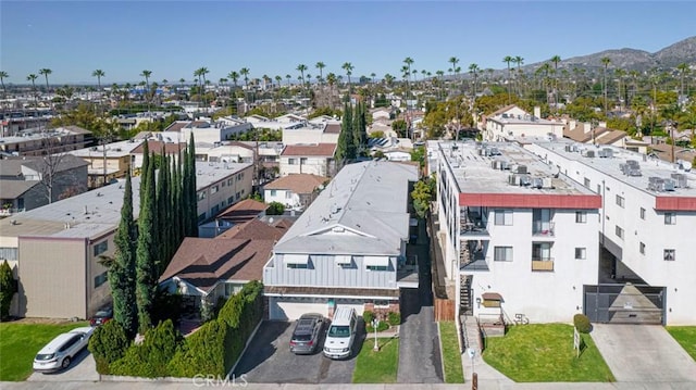 drone / aerial view with a residential view and a mountain view
