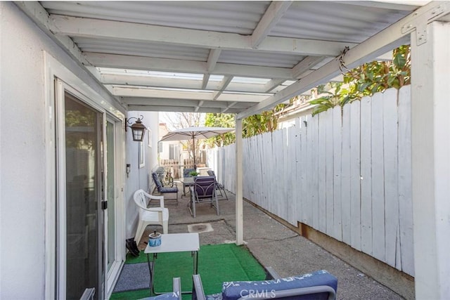 view of patio featuring fence