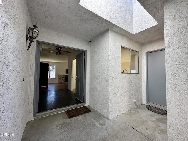 property entrance with stucco siding