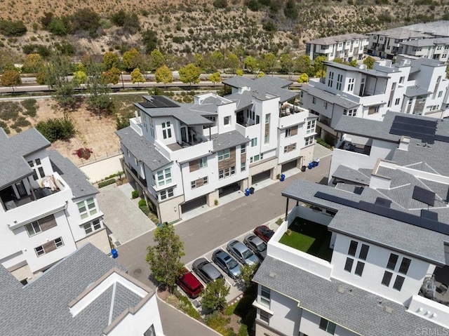 birds eye view of property with a residential view