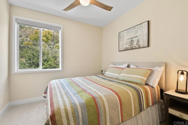 bedroom with baseboards, ceiling fan, and carpet floors