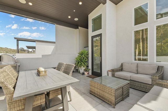 view of patio featuring an outdoor living space and outdoor dining space