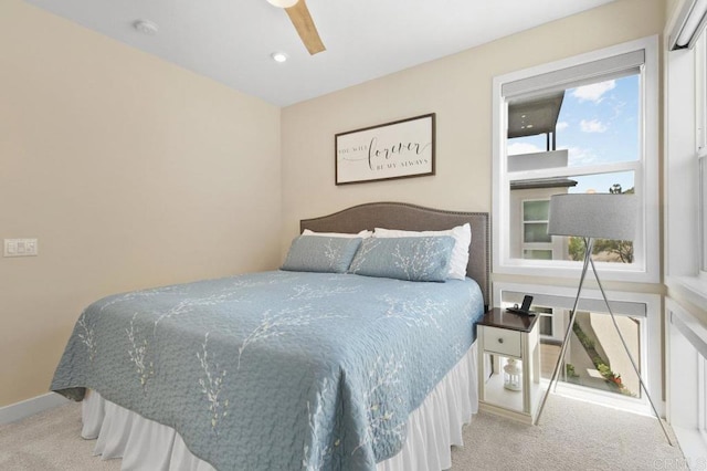 bedroom featuring carpet floors, baseboards, and a ceiling fan
