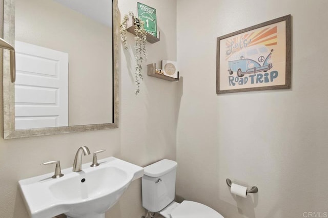 bathroom featuring a sink and toilet