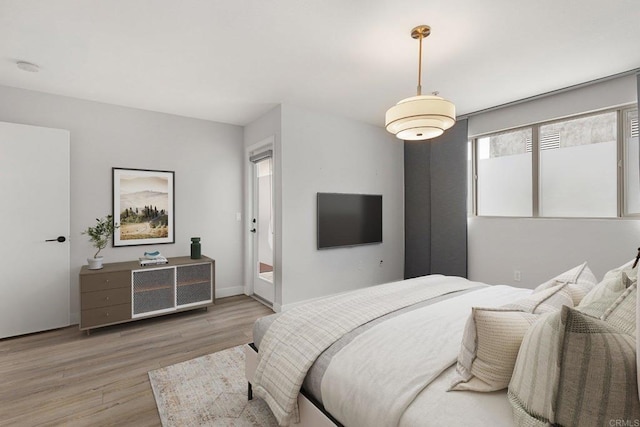 bedroom featuring light wood-type flooring