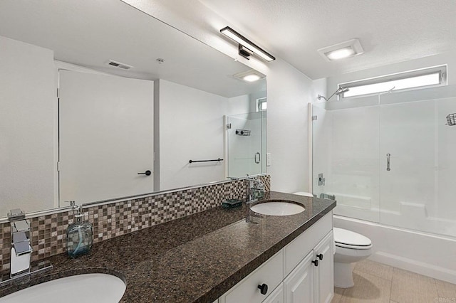 687 S Coast Highway 101 Unit 232, Encinitas, CA 92024 - bathroom with double vanity, tasteful backsplash, and shower / bath combination with glass door