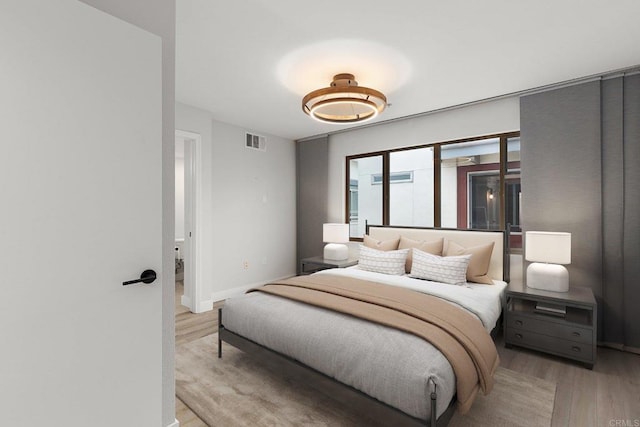 687 S Coast Highway 101 Unit 232, Encinitas, CA 92024 - bedroom featuring light wood-style floors and baseboards