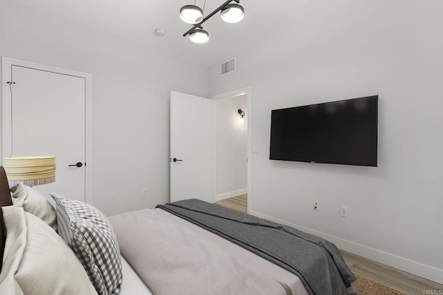 687 S Coast Highway 101 Unit 232, Encinitas, CA 92024 - bedroom featuring wood finished floors and baseboards