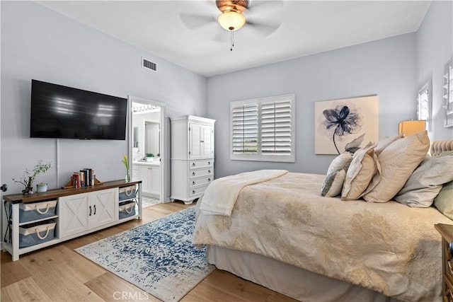 bedroom featuring light wood-style floors, multiple windows, ceiling fan, and visible vents