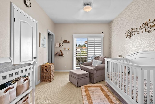carpeted bedroom with baseboards