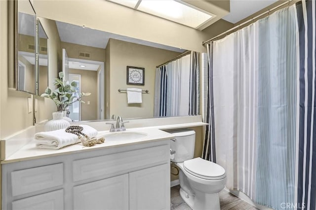2641 Dunstan Dr, Tustin, CA 92782 - bathroom with toilet, visible vents, and vanity