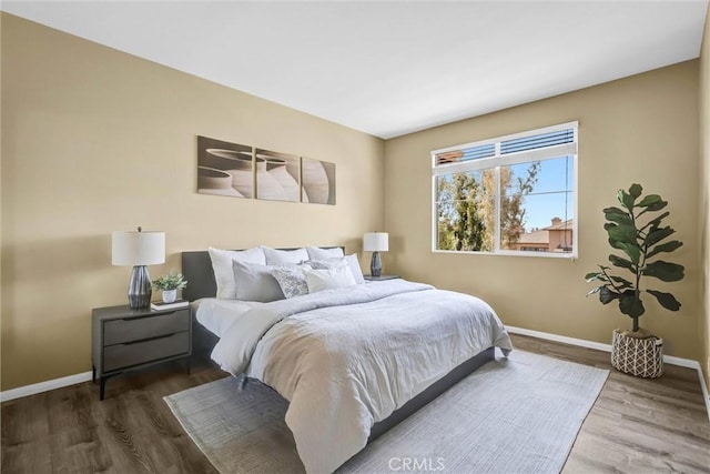 2641 Dunstan Dr, Tustin, CA 92782 - bedroom featuring baseboards and wood finished floors