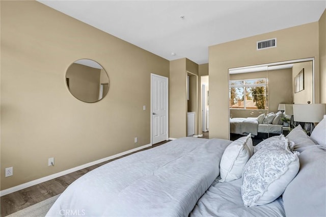 2641 Dunstan Dr, Tustin, CA 92782 - bedroom featuring baseboards, visible vents, wood finished floors, and a closet