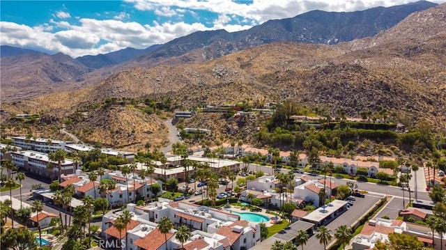 2240 S Palm Canyon Dr Unit 20, Palm Springs, CA 92264 - aerial view of property's location featuring a mountain backdrop, a pool area, and nearby suburban area