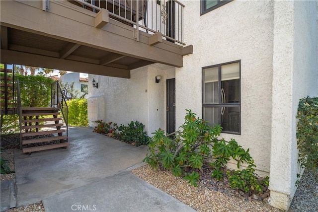 2240 S Palm Canyon Dr Unit 20, Palm Springs, CA 92264 - entrance to property featuring stucco siding and a balcony